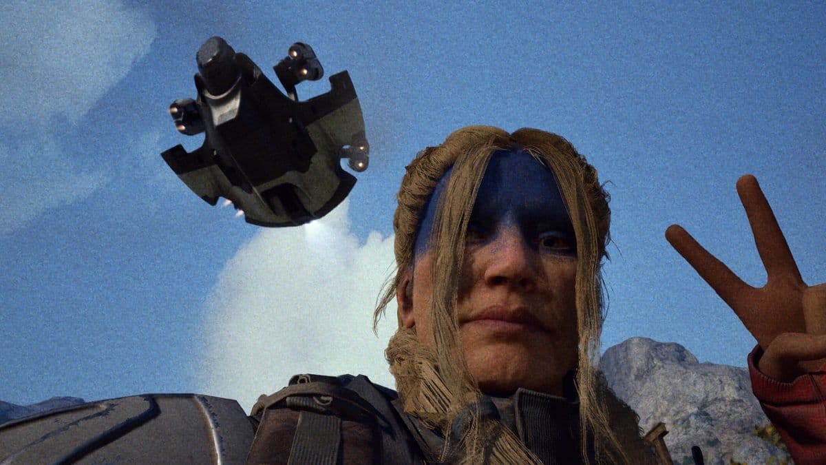 A Raider taking a selfie with the new camera, flashing a peace sign under a hovering drone