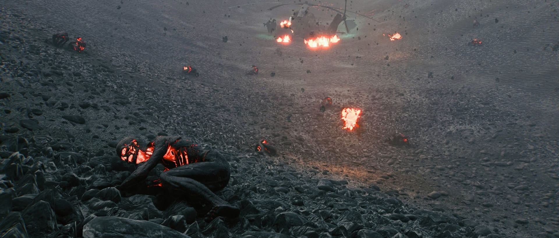 Burning bodies and scattered fires glow on a scorched hillside beneath a smoking helicopter wreck in Ozernoe: Firestorm
