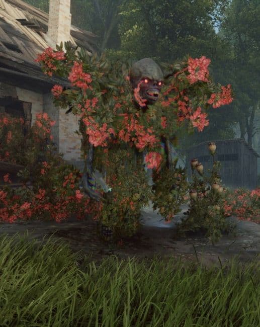 A Flowerman covered in red flowers standing among bushes outside a cottage, red eyes glowing
