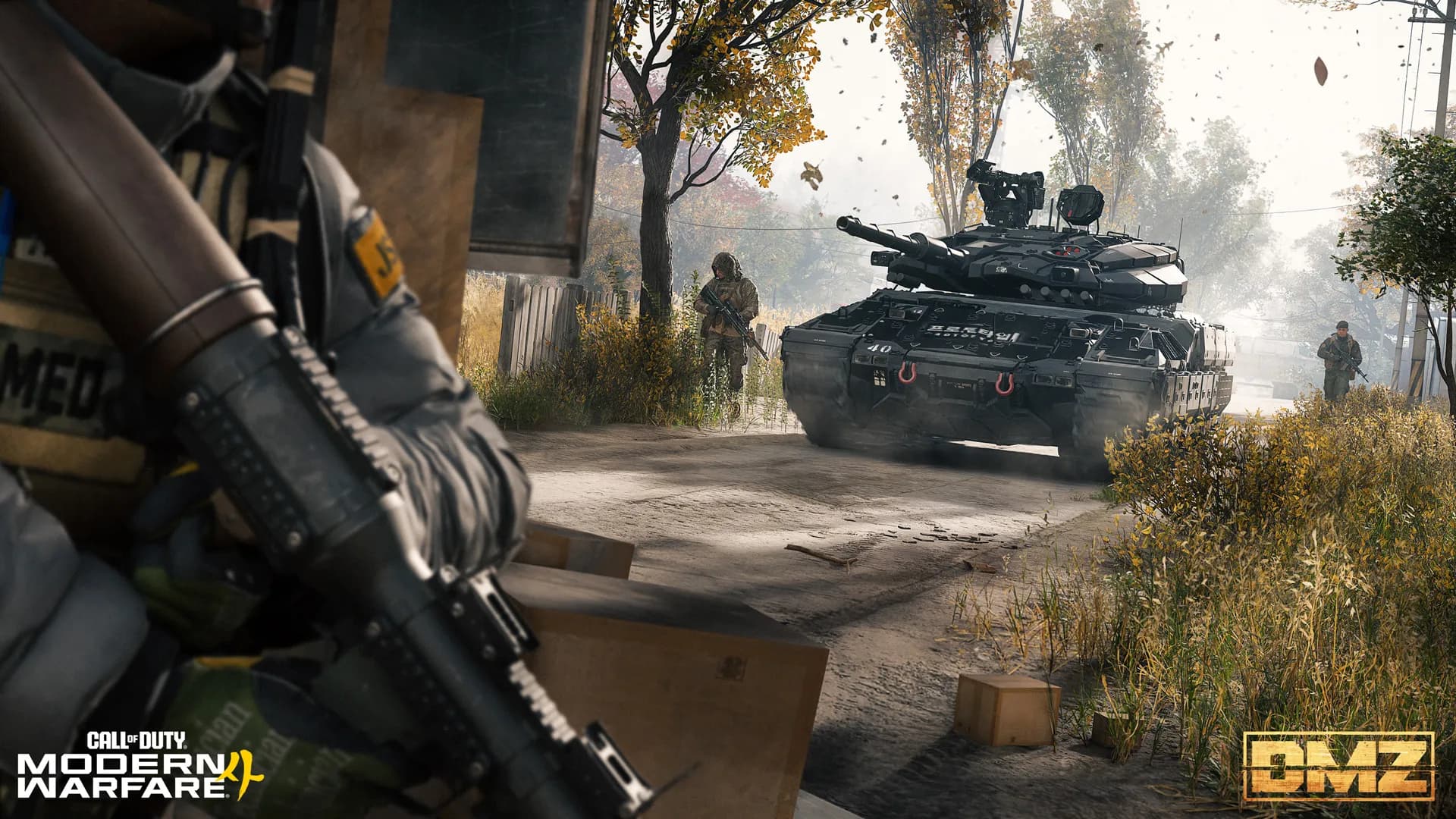 An Operator aiming down a Hajin street with an armoured vehicle advancing behind