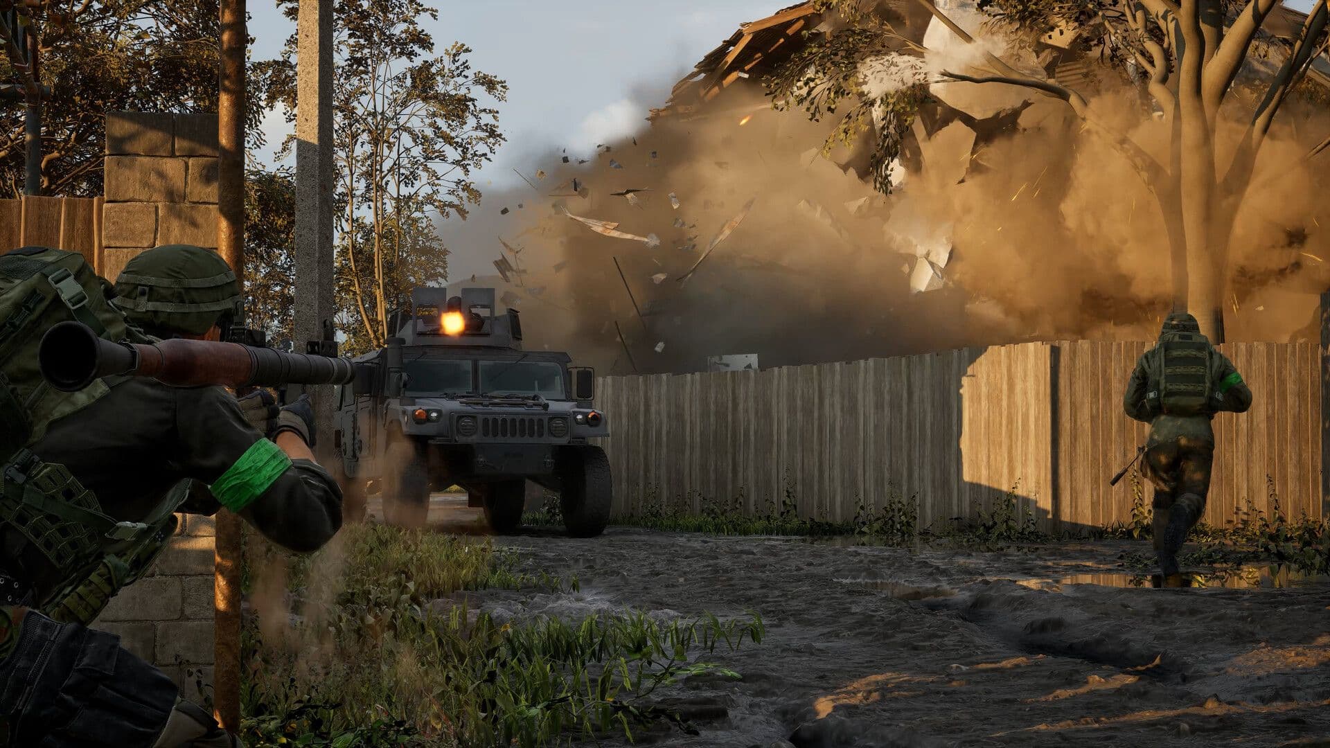 A soldier fires a rocket launcher at an armoured truck as a building explodes behind it