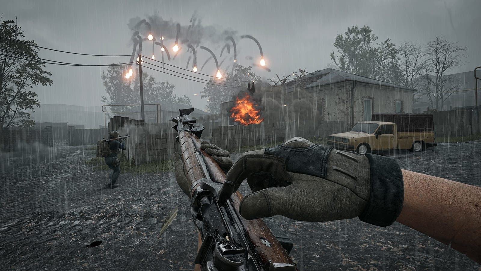 A wood-stocked M14 held in first person in the rain as flares burn over a village
